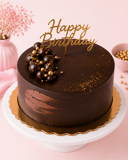 Elegant chocolate birthday cake with gold decorations and Happy Birthday topper by GUL BAKE
